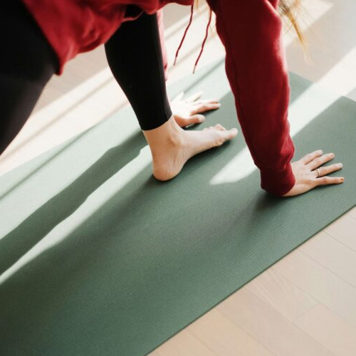 Person doing pilates on a mat